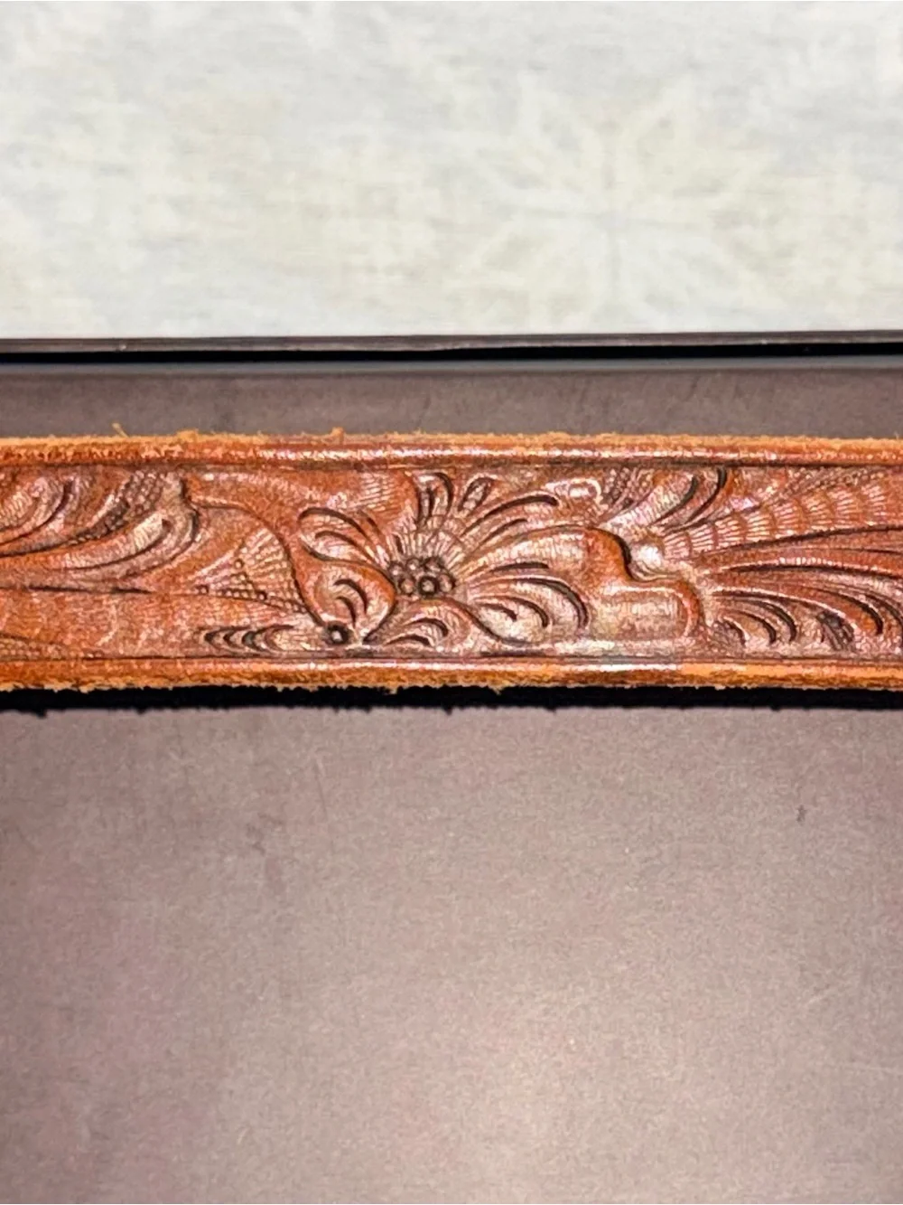Vintage Western tooled leather belt with a three-piece engraved silver-tone 26